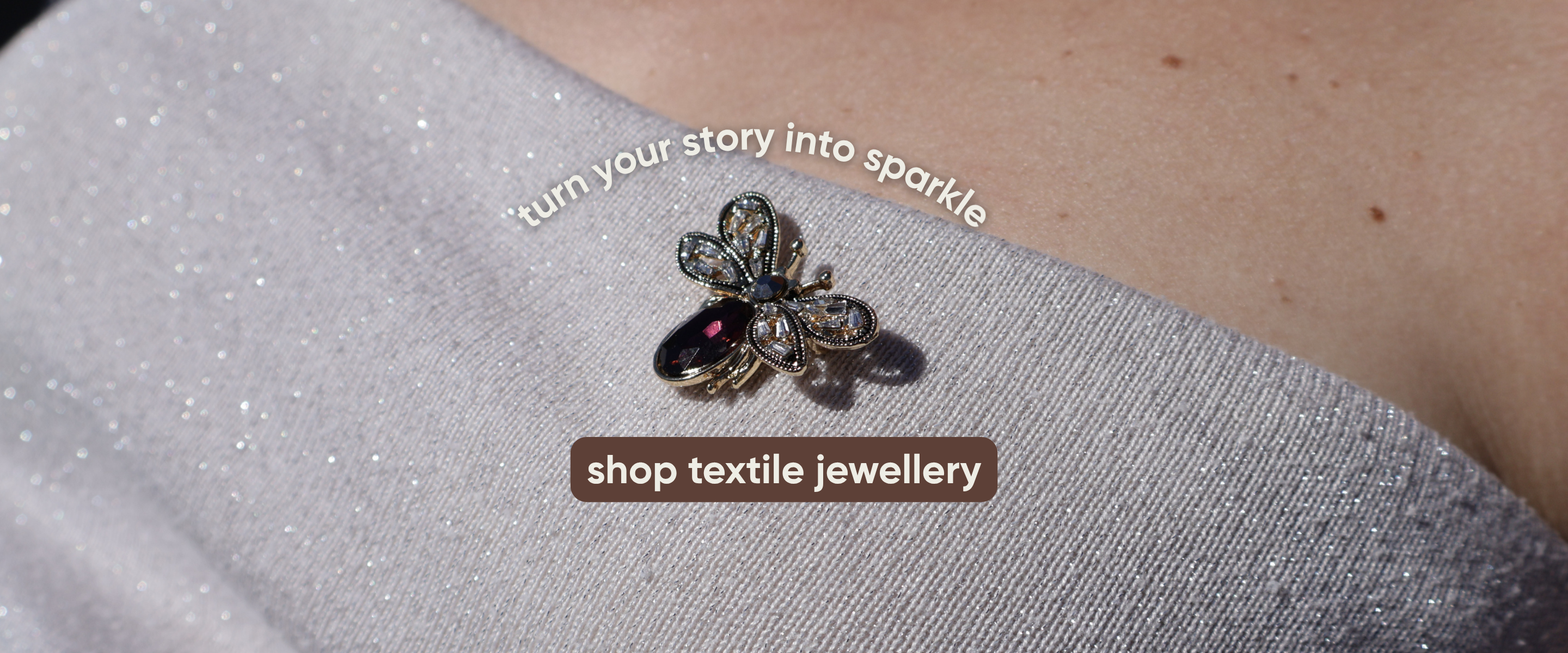 red butterfly brooche on sparkling woman top