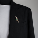 10023 brooch pin gold snake with green bead on black blazer