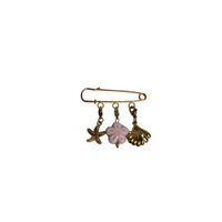 sierspeld goud met zeester, schelp en roze bloem