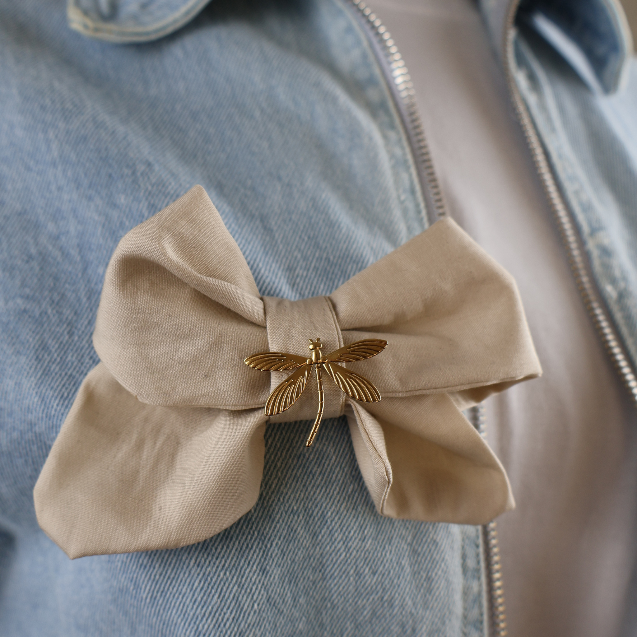 Beige bow fabric with safety pin