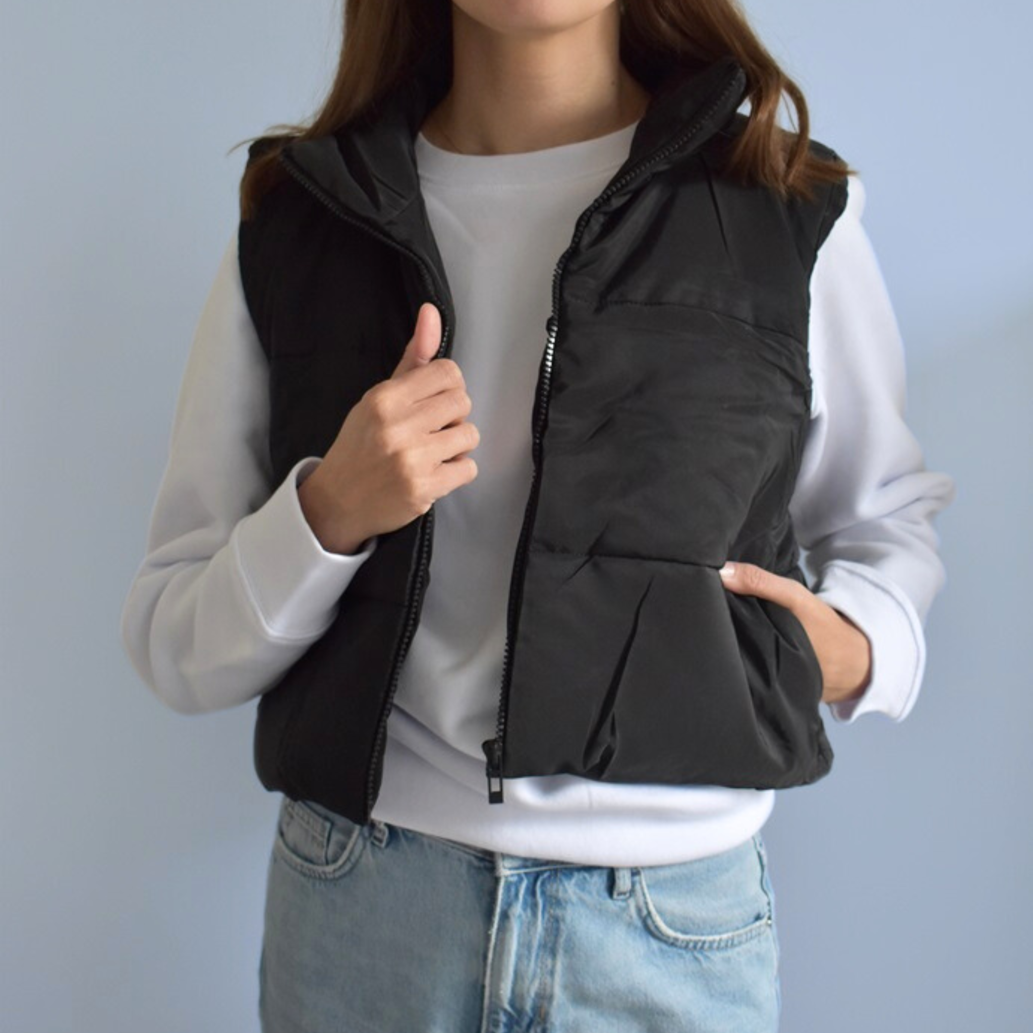 Black quilted bodywarmer with zip and pockets