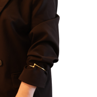 Gold sleevholder with 2 balls on black blazer