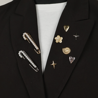 Brooches  and pin on black blazer
