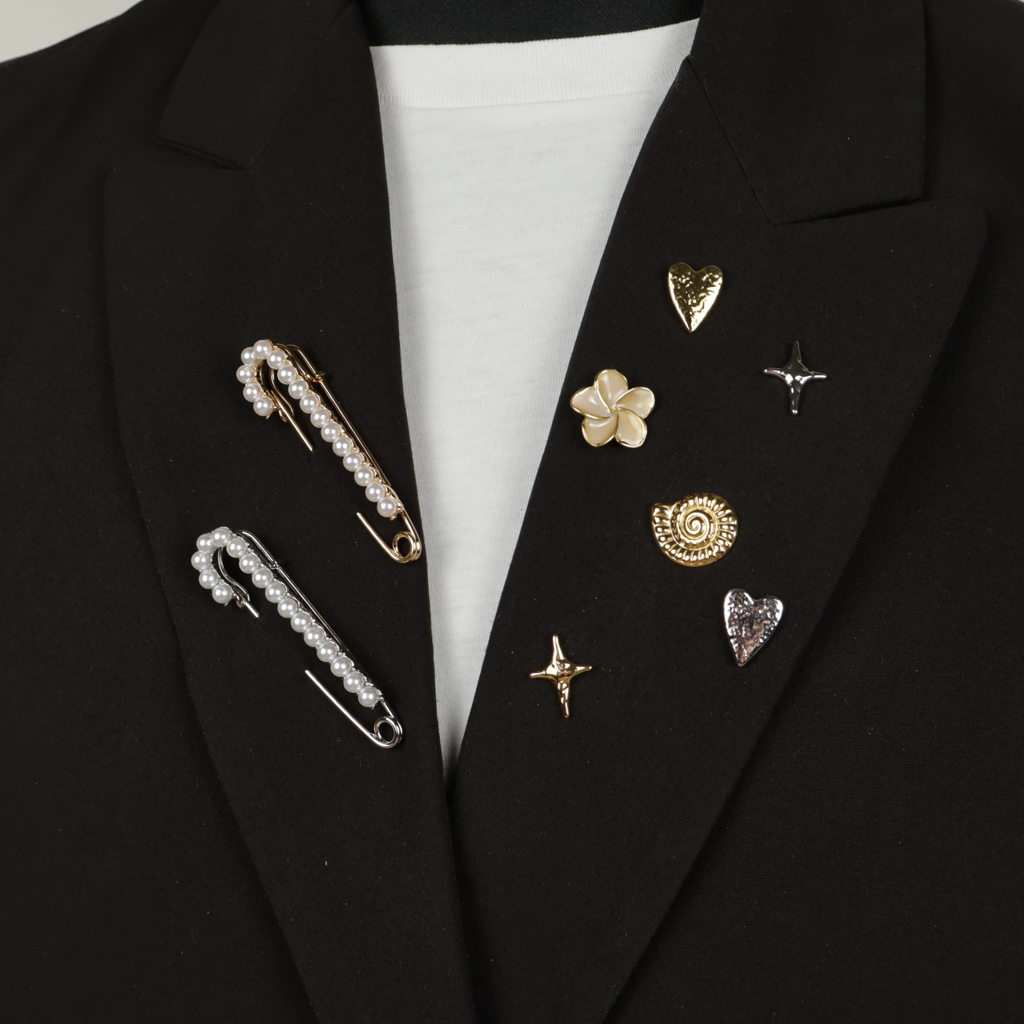 Brooches  and pin on black blazer