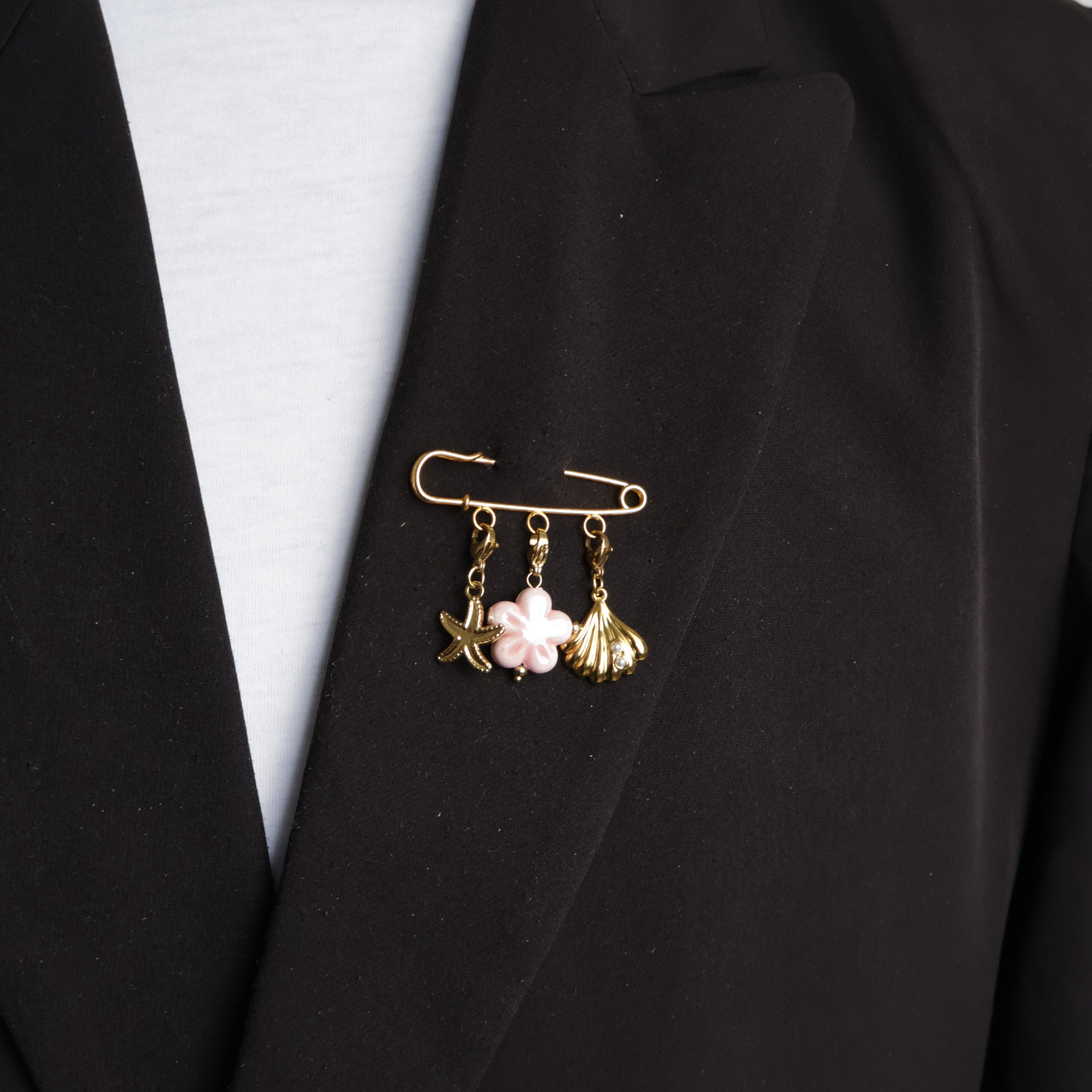 Gold safety pin with starfish, pink flower and shell